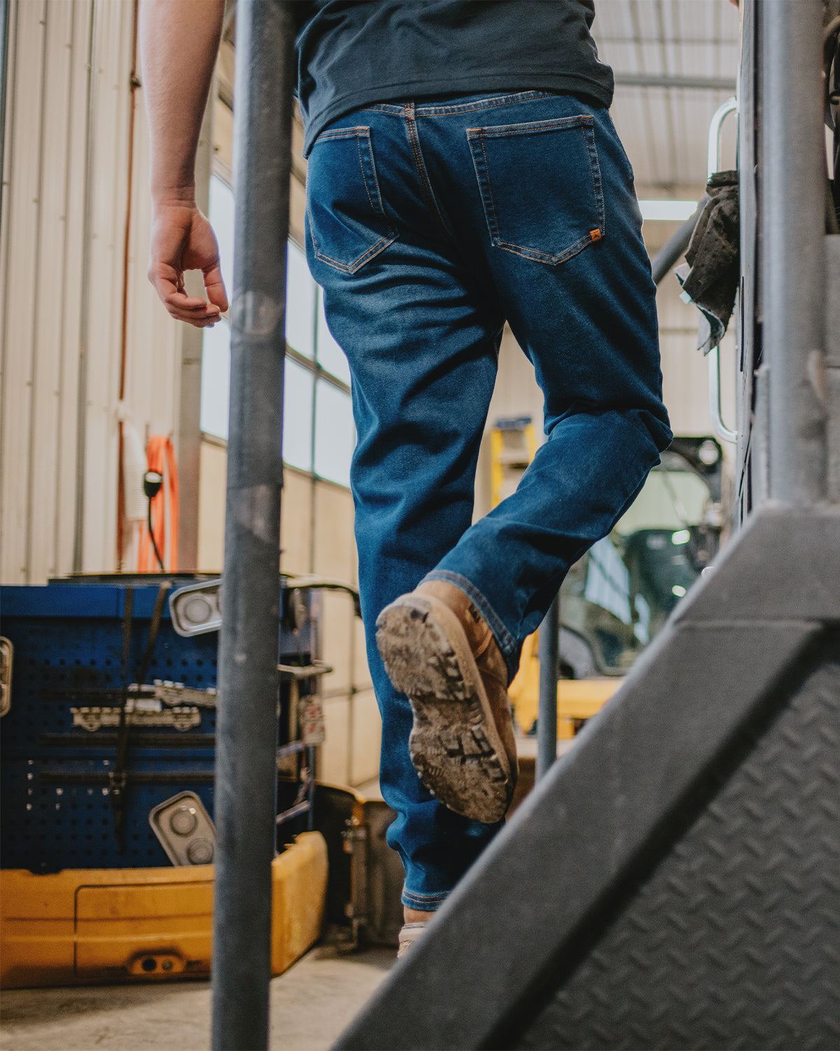 Cat Workwear MEN'S D1 STRAIGHT LEG JEAN Going Up Stairs