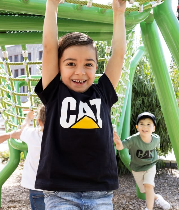 CAT workwear kid's tm logo t-shirt black on model at the playground