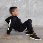 CAT workwear kid's trademark banner hoodie black on model