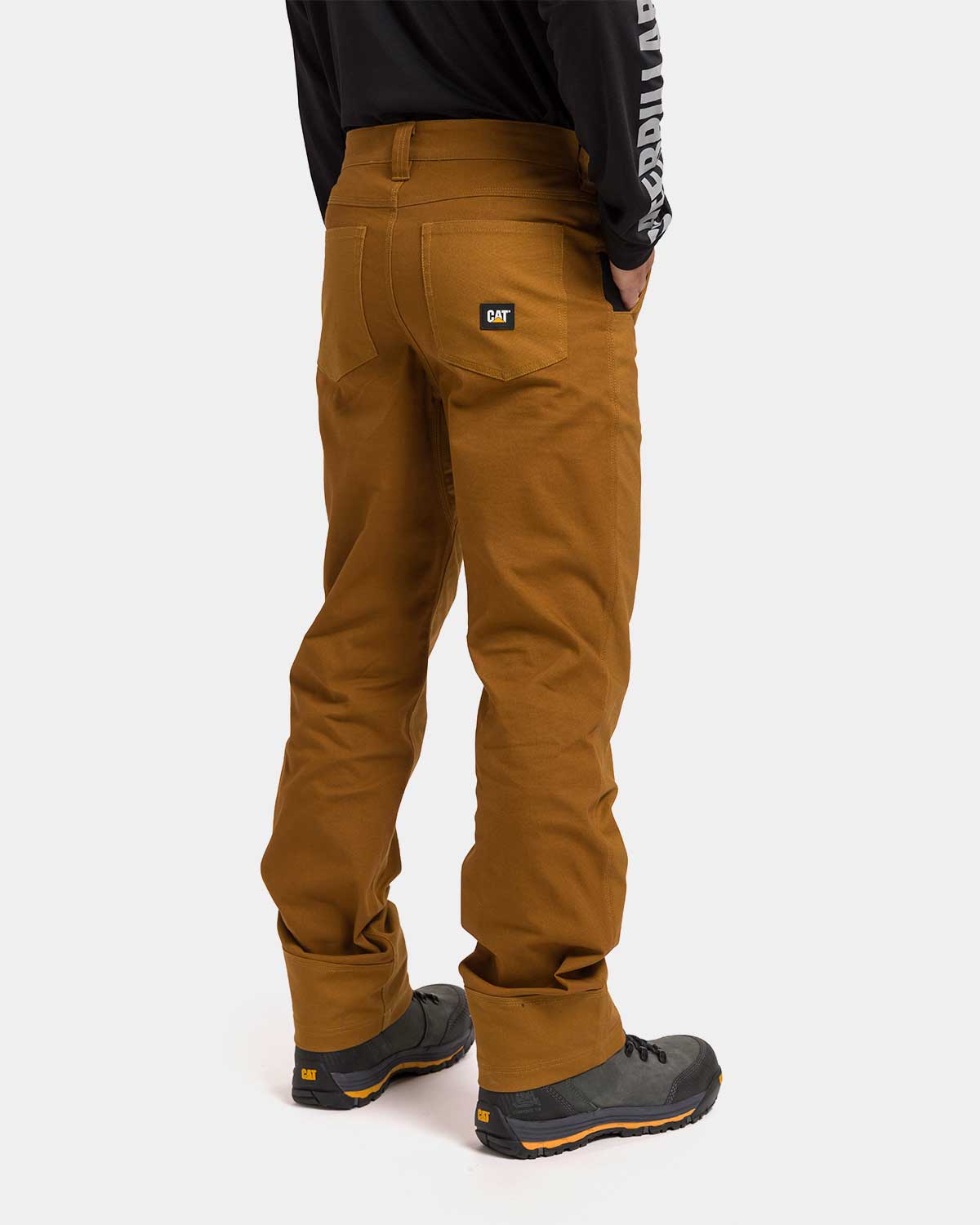 CAT Workwear Men's Brush Pant Bronze on model back, color:Bronze