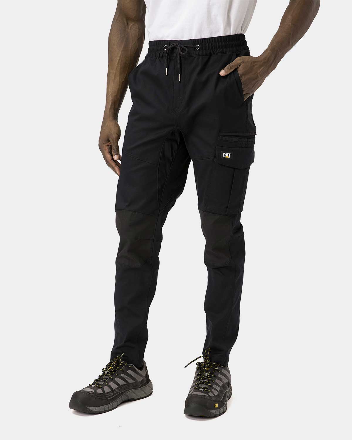 Cat Workwear Men's Dynamic Work Pant Black on model left side, color:Black