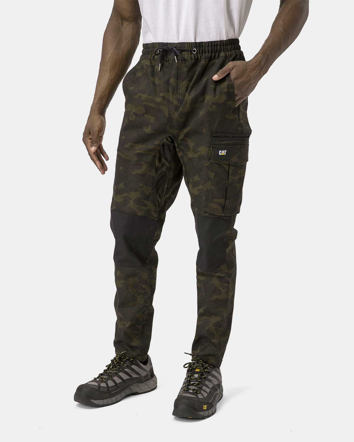 Cat Workwear Men's Dynamic Work Pant Night Camo on model left side, color:Night Camo