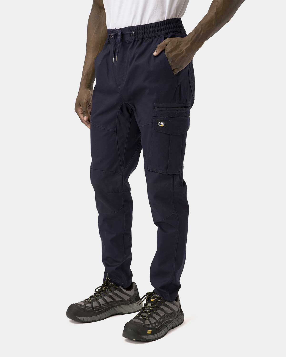 Cat Workwear Men's Dynamic Work Pant Navy on model left side, color:Navy