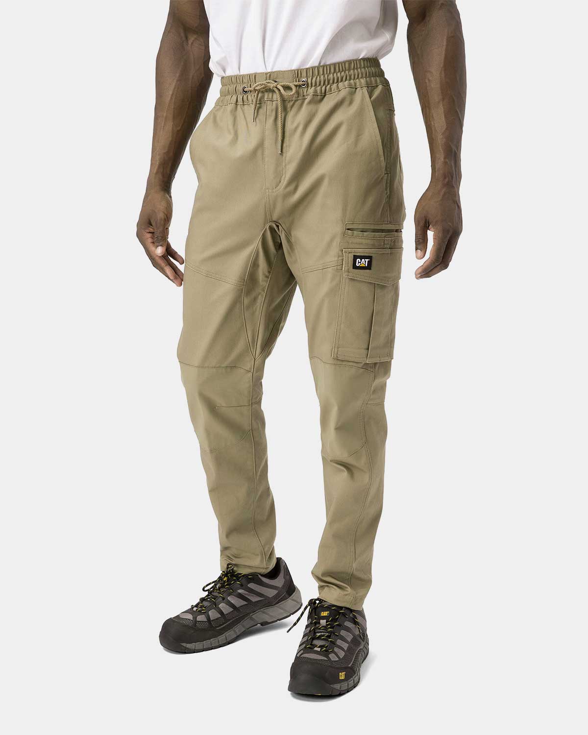 Cat Workwear Men's Dynamic Work Pant Khaki on model left side, color:Khaki