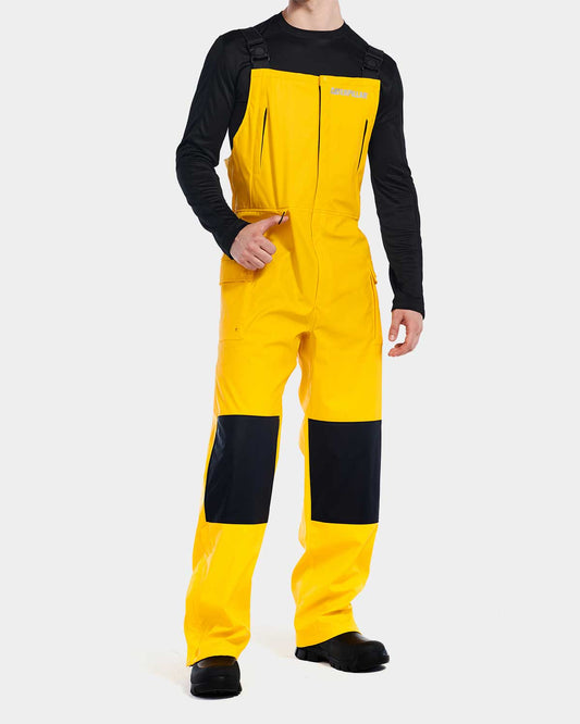 Cat Workwear Men's Longshore Waterproof Rain Bib Yellow on model front, color:Yellow