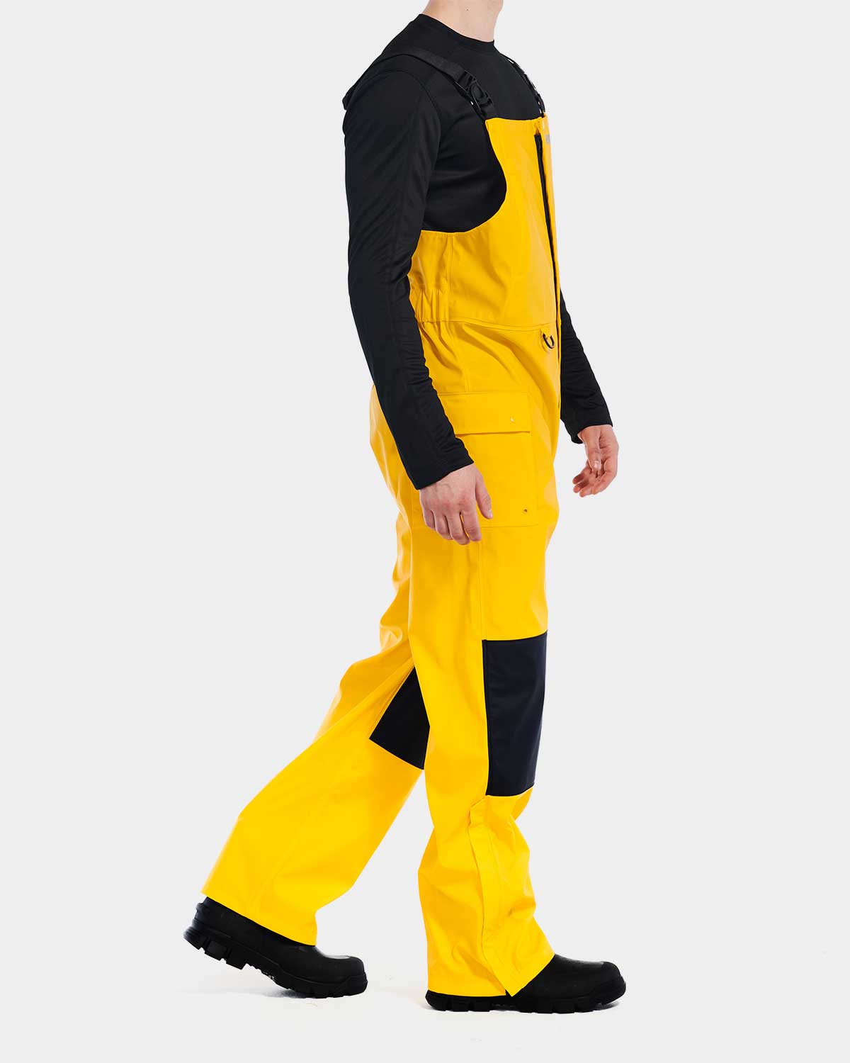 Cat Workwear Men's Longshore Waterproof Rain Bib Yellow on model right side, color:Yellow