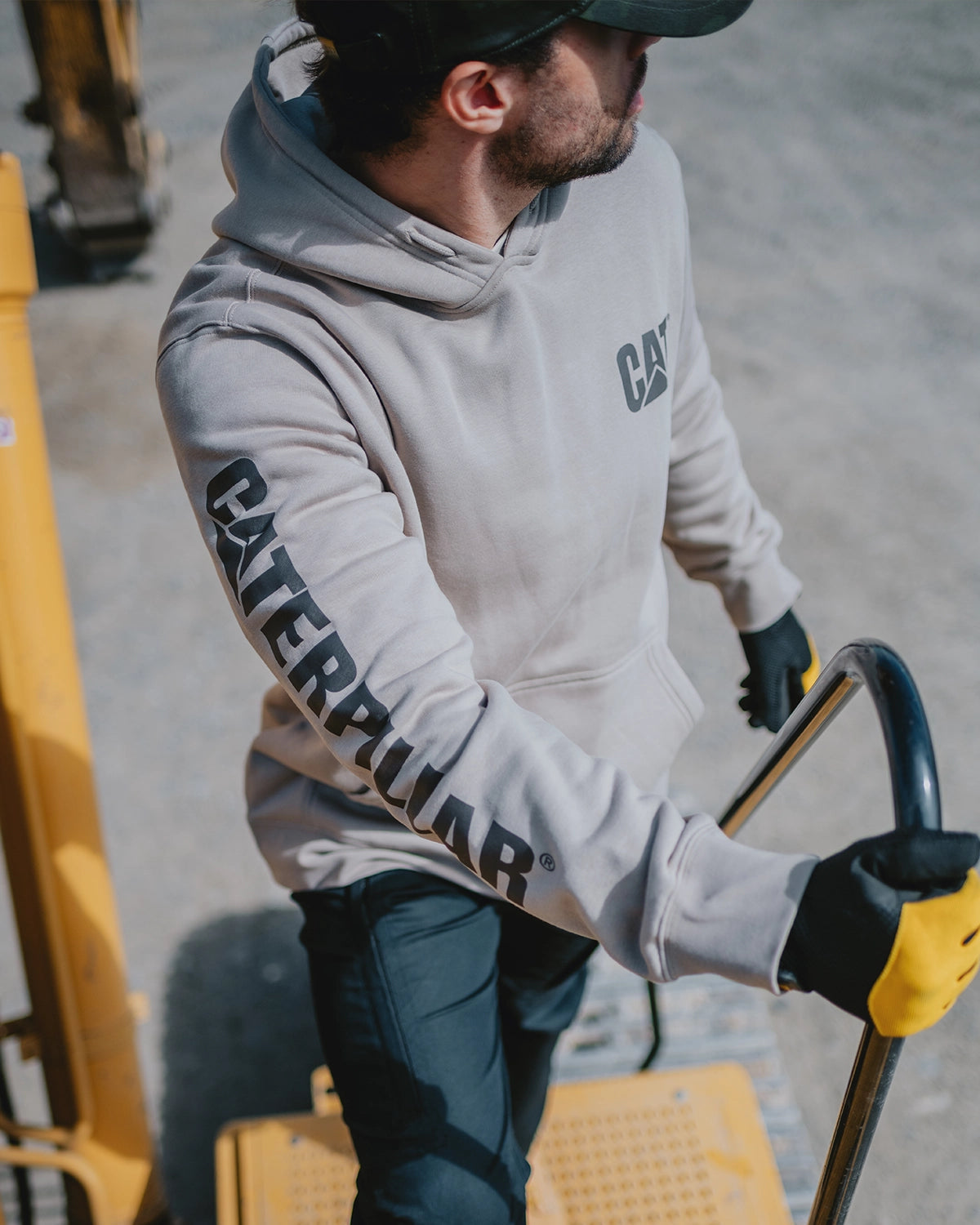 CAT workwear men's midweight trademark banner pullover hoodie heather grey on model