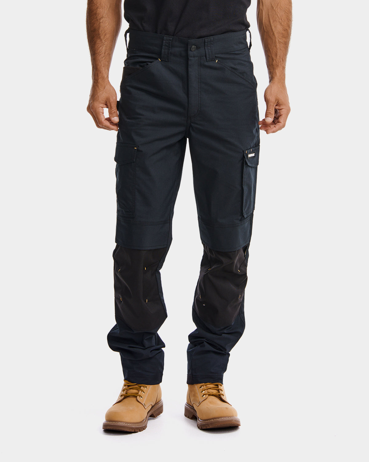 Cat workwear Men's Nexus Work Pant Black on model front, color:Black