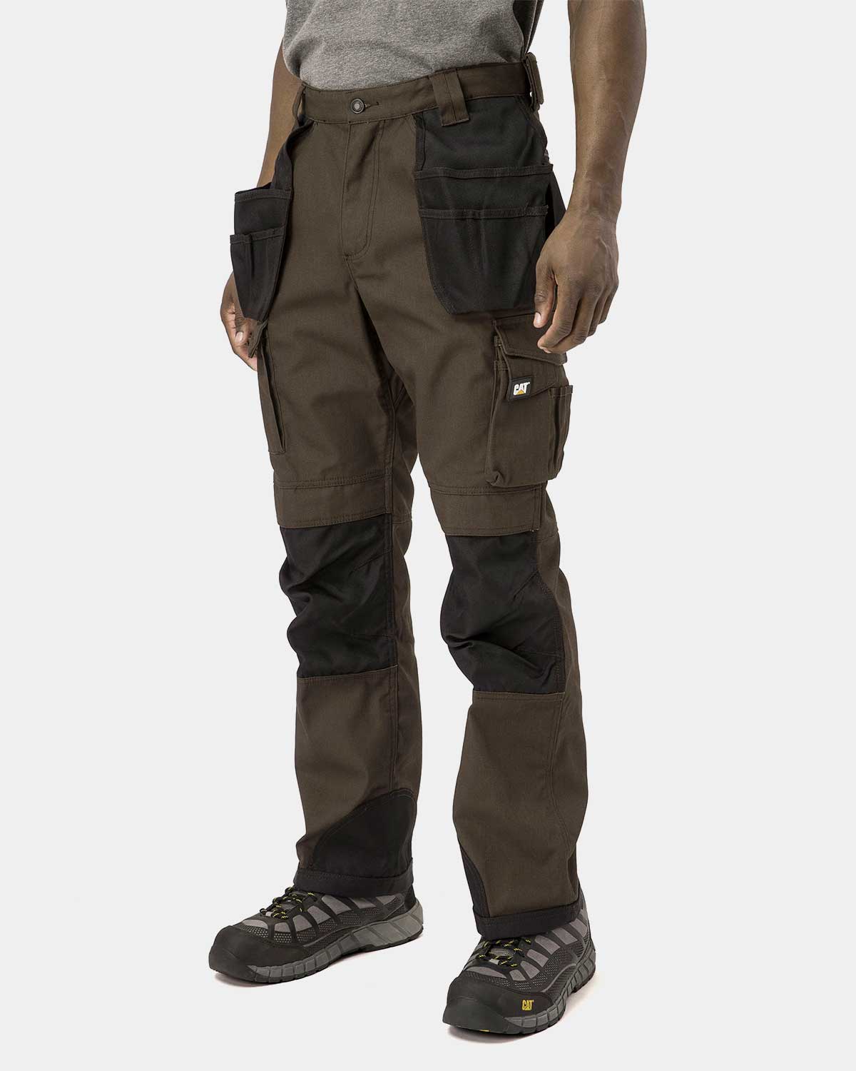 Cat Workwear Men's Trademark Work Pants Dark Earth On Model left side, color:Dark Earth