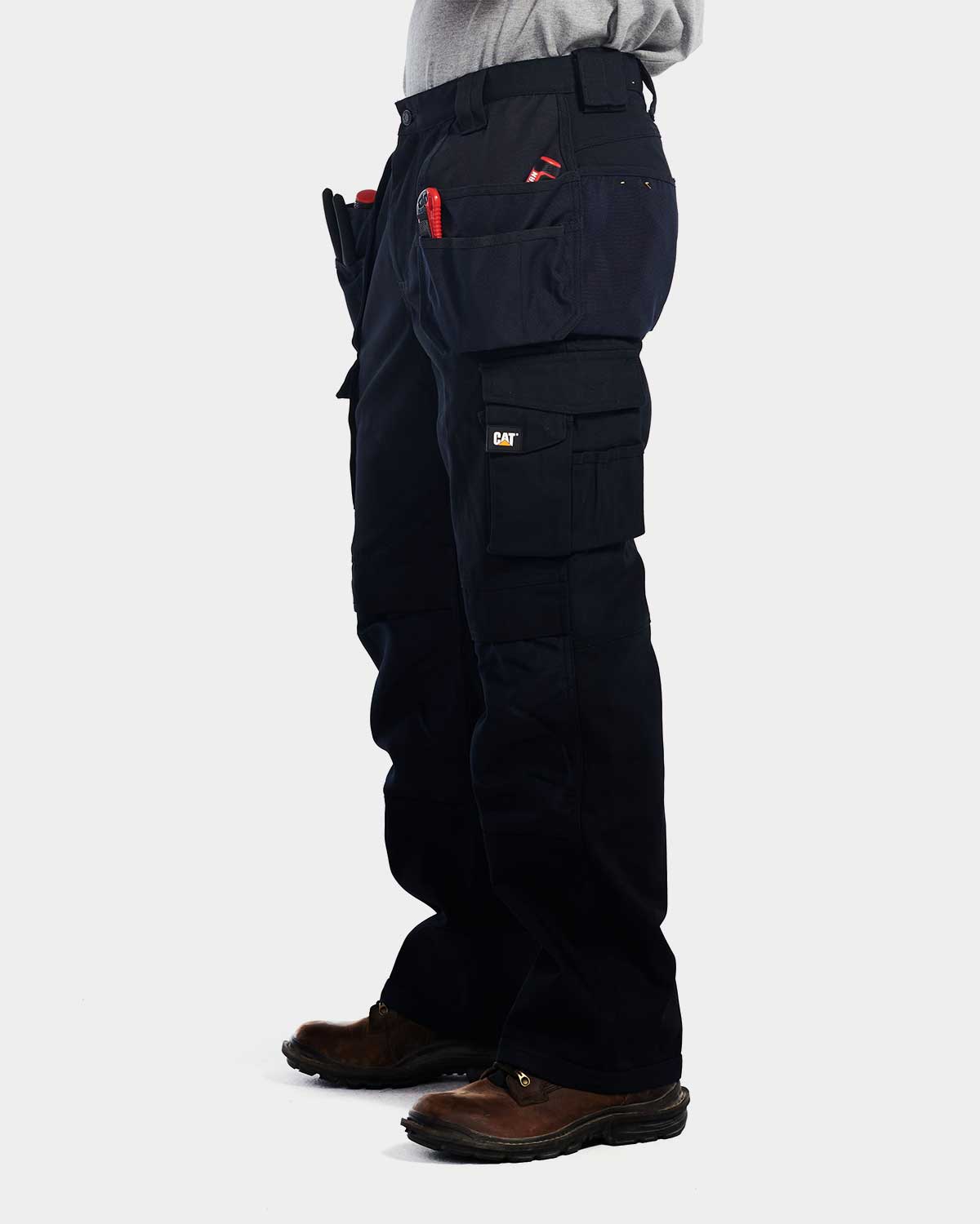 Cat Workwear Men's Trademark Work Pants Navy On Model left side, color:Navy